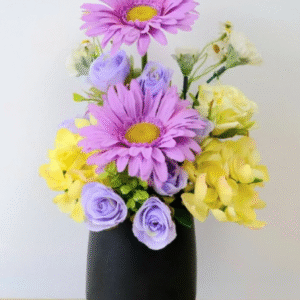 ดอกเยอบีร่าประดิษฐ์ผ้าในแจกัน สีม่วง/เหลือง